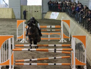 O' Reillys Wholesalers Newry sponsored HSI / Bluegrass Spring Tour Grand Prix winners, Daniel Coyle & Uptown Girl clear the double being urged on by the large crowd of spectators at Ravensdale Lodge on Sunday