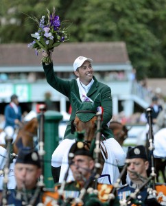 Cian O'Connor, Ireland, on Blue Loyd 12, celebrates after his team's victory in the FEI Nations Cup. Dublin Horse Show 2012, Main Arena, RDS, Ballsbridge, Dublin. Picture credit: Matt Browne / SPORTSFILE 