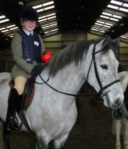 Tara Murphy show off the red rosette earned by Barney and her