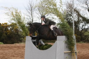 Robbie McNeil competing in the 90cm Working Hunter Class