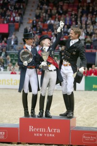Having fun on the podium at the Reem Acra FEI World Cup™ Dressage Final in Gothenburg, Sweden today - L to R - runner-up Adellinde Cornelissen NED, new Reem Acra champion Helen Langehanenberg GER and Edward Gal NED who finished third.  Photo: FEI/ Roland Thunholm.