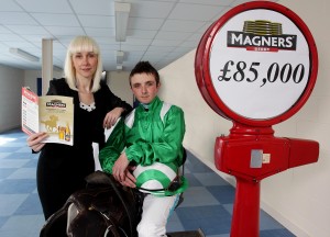 Sarah Ratcliffe Magners Brand Manager at Tennent's NI is pictured with jockey Chris Hayes at the launch of this year's Magners Derby which takes place on 22nd June. Chris, a former winner of the Magners Derby in 2007 and 2010 is planning to race at this year's meeting and hoping to make it a lucky treble.