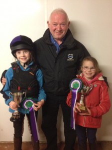 Jim priestly presenting cups to Friday night winners - Zara burns and Shannon boville