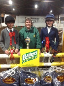 Judy maxwell of Baileys horse feed sponsor of the inter schools league presents prizes to overall winning team - shimna college