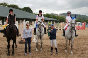 "All the girls" Janine Farrell, Lynn Patterson, Caroline Mc Guirk & Hannah Joyce line up with judge Alison Fernandez after the 1m league final held at Ravensdale Lodge on Wednesday. Janine Farrell won both the 90cm & 1m finals riding her own Blackmoor Heather.