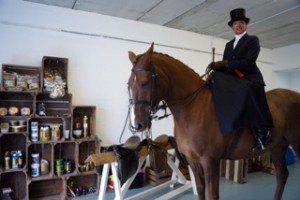 Ashleigh Kirkpatrick on Alfie browsing the side saddle and showing clothing and equipment on offer at Equishop Saintfield