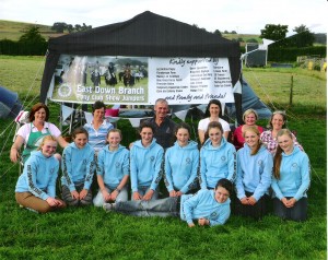Novice showjumpers with support team at the campsite in Chesire