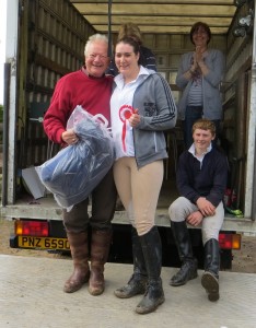 Fiona Magill winner of the Open 90cm class being congratulated by Tommy Caves