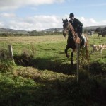 Huntsman Jonny Butler on Big Al  about to clear the ditch