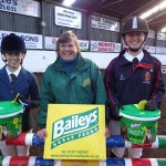 Results of the first round of the BAILEYS Inter Schools league.
L-R Victoria O’Connor Judy Maxwell (BAILEYS HORSE FEEDS) Anna Miller winners of spot prizes for best turned out both riders from Wallace High School