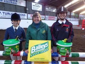 Results of the first round of the BAILEYS Inter Schools league. L-R Victoria O’Connor Judy Maxwell (BAILEYS HORSE FEEDS) Anna Miller winners of spot prizes for best turned out both riders from Wallace High School