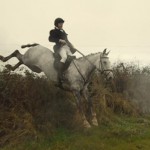 Eamon O'Connor taking aflyer over a hedge