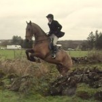 Kate Alcorn jumping the stone walls