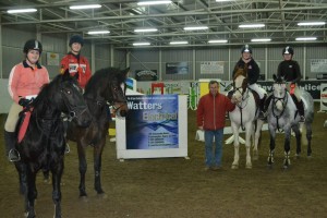 Winners in the 1m class. First left: Michaela Nugent and Katie's Star winners of the Watters Electrical Voucher. Presentation by James Kernan.