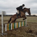 Hope Gardner on Rufus clears the practice jump