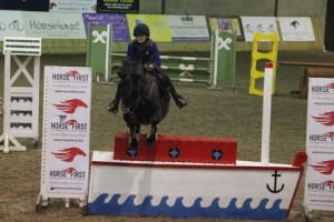 "Jumping ship", Melissa Mc Kee & Prince Of Hearts jumps the Horse First joker fence during Saturday's 1m class in the indoor arena eventing league at Ravensdale Lodge.