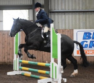 "Sir Barney" and Karen Jeffrey jump their way over the 60cm course to win Class 3 overall