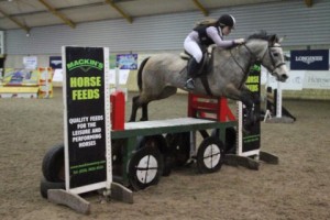 Hannah Chambers & Pumpkin on a flier over the Mackins Horse Feeds joker fence in the 85cm class at Ravensdale Lodge on Saturday during the indoor arena eventing league.