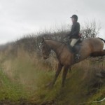 Kate Alcorn on Jeeves clearing the fence