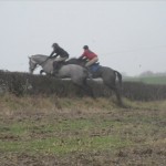 Simon Carson and Hannah Patterson jump the hedge together