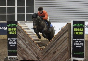 "All joking aside", Sarah Steen & Jack in a determined frame of mind as they takes on the new joker fence at the Mackins Horse Feeds indoor arena eventing league at Ravensdale Lodge on Saturday. Photo: Niall Connolly.