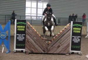 Eili Duncan, seen here jumping the joker fence in the 85cm class with Dakota Cruise had a great day at Ravensdale Lodge on Saturday in the Mackins Horse Feeds indoor arena eventing league as she gained the maximum 3 points in both the 70cm & 85cm classes Photo: Niall Connolly,