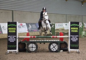Orla Mc Gowan & Manus Boy on a flier over the joker fence in the 1m class at the Mackins Horse Feeds indoor arena eventing league at Ravensdale Lodge on Saturday.