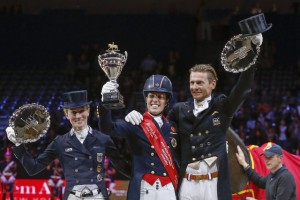 Great Britain’s Charlotte Dujardin (centre) claimed the Reem Acra FEI World Cup™ Dressage 2014 title at Lyon, France today after a spectacular Freestyle performance with Valegro.  Pictured with her on the prize-winner’s podium are (left) runner-up Germany’s Helen Langehanenberg and (right) third-place Edward Gal from The Netherlands.  Photo: FEI/Dirk Caremans.
