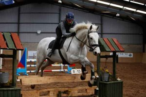 Elaine gardener and Sam on their way to winning the 90cm league