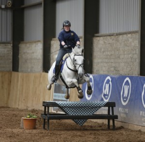 Anne Sheridan and gypsy clearing the optional joker fence at Knockagh view equestrian centre's jump cross final