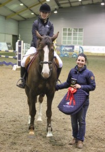 Smiles all round as Jessica Finnegan with Sunday Cruise, seen here with her mother Denise is presented with her prizes after winning the 1.10m class at Friday evenings horse & pony training league at Ravensdale Lodge. Jessica went on to have a very successful weekend adding to her victory in Sunday's dressage league final. Photo: Niall Connolly.