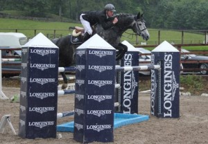 Alexander Butler who was double handed in the jump off at the Longines National Grand Prix at Ravensdale Lodge had to settle for third and fourth place in a thrilling class. Photo: Niall Connolly.