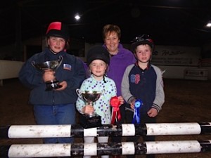 Olive Greene presents cups to winners - Hannah Orr, Chloe McMullan and runner up Edmund Whiteside