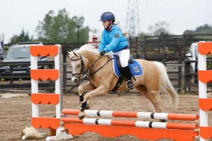 Jessica Davidson and Sovvy on their way to winning the 60cm class
