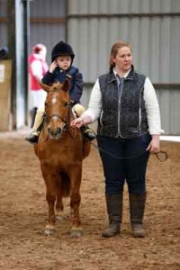 Riah Mcfaul and her pony little chief on their way to 4th place in the family pony lead rein