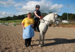 Smiles all round & blue skies above as Katie Creegan, seen here with Dolly & Mum Trish, struck a rich vein of form (and luck) as she collected her saddle pad after her name was picked from the draw and won the class prize after going clear in the 70cm class at Ravensdale Lodge's horse & pony training league on Friday. Photo: Niall Connolly.