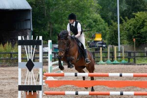 Chloe hope and topcat on their way to winning the 80cm class and taking home a beautiful trophy Photo AP Photography