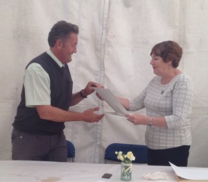 Steven Smith receiving his Cubitt Award from Area 17 Representative Liz Lowry