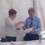 Billy McCombe receiving his Cubitt Award from Area 17 Representative Liz Lowry