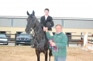 Connor McEneaney and Moonlite Cavalier, Winners of the main eveny the 1.25m clalss. Presentation by James Kernan.