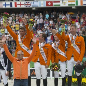 The Dutch claimed gold in the Jumping team championship at the Alltech FEI World Equestrian Games™ 2014 in Normandy today. L - R Jeroen Dubbeldam, Gerco Schroder, Maikel van der Vleuten and Jur Vrieling with Chef d'Equipe Rob Ehrens. (Dirk Caremans/FEI)