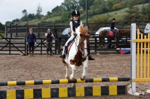 Kristie Wilson on her way to winning the trophy in the 50cm class
