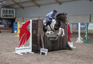 Gaye Ferris with Vegas clear the Horse First joker fence with ease in the 85cm class at Ravensdale Lodge's indoor arena eventing league on Saturday afternoon. Photo: Niall Connolly.