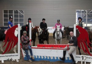 There were nine clear rounds in the 85cm class at the Horse First indoor arena eventing league at Ravensdale Lodge and eight of them picked up the maximum 3 points. Pictured at the Horse First joker fence after presentation of rosettes are Conor Meehan, Ellen Hollywood representing Louise Hollywood, Anne Mc Farland, Jackie Loughran, Gene Murray, June Ellenberg and Jenny Montgomery who went clear on both her horses and picked up the Horse First product prize in the draw for her efforts.Photo: Niall Connolly. 