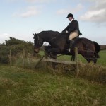 Philip Abernethy clearing the fence  on his first hunt outing with The Route