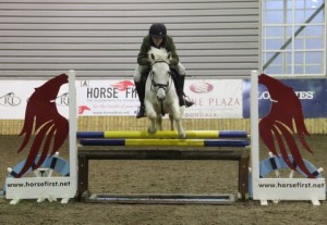  Conall Mc Grath & Bannfield Boy ping the optional Horse First "joker" fence in the 1m class at Ravensdale Lodge's indoor arena eventing league on Saturday.  Photo: Niall Connolly.