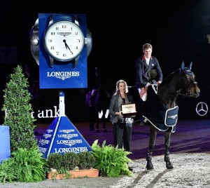 Great Britain’s William Whitaker pictured with Longines representative Christiane Becherer after his victory with Fandango in today’s Longines FEI World Cup™ Jumping 2014/2015 Western European League qualifier at Stuttgart, Germany. (FEI/Karl-Heinz Freiler)