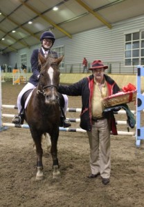 Sean Cooney, managing director of Botanica International presents 80cm class winners Orla Moriarity and Thunder with their prizes at the Botanica International horse & pony training league final at Ravensdale Lodge on Friday evening. Photo: Niall Connolly. 