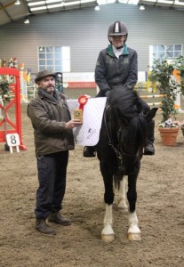 Sinead Young & Jacobi, seen here being presented with their prizes came out on top of a huge entry in the 80cm class at the "Bumper Christmas Show" held at Ravensdale Lodge on Sunday. Photo: Niall Connolly. 
