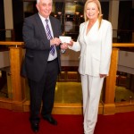Manager of The Bank of Ireland Downpatrick presents a cheque to Saintfield Christmas Charity Ride Organiser Joan Cunningham to go towards funds.